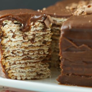Icebox matzo cake recipe - Easy no bake dessert to serve during Passover Seder. Combine layers or matzos dipped in wine and top with a creamy chocolate icing.